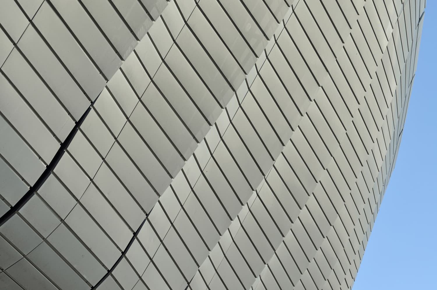 Repeating structural pattern of a modern stadium roof