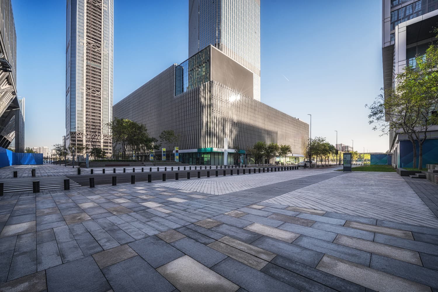 Modern civic buildings around an empty public square