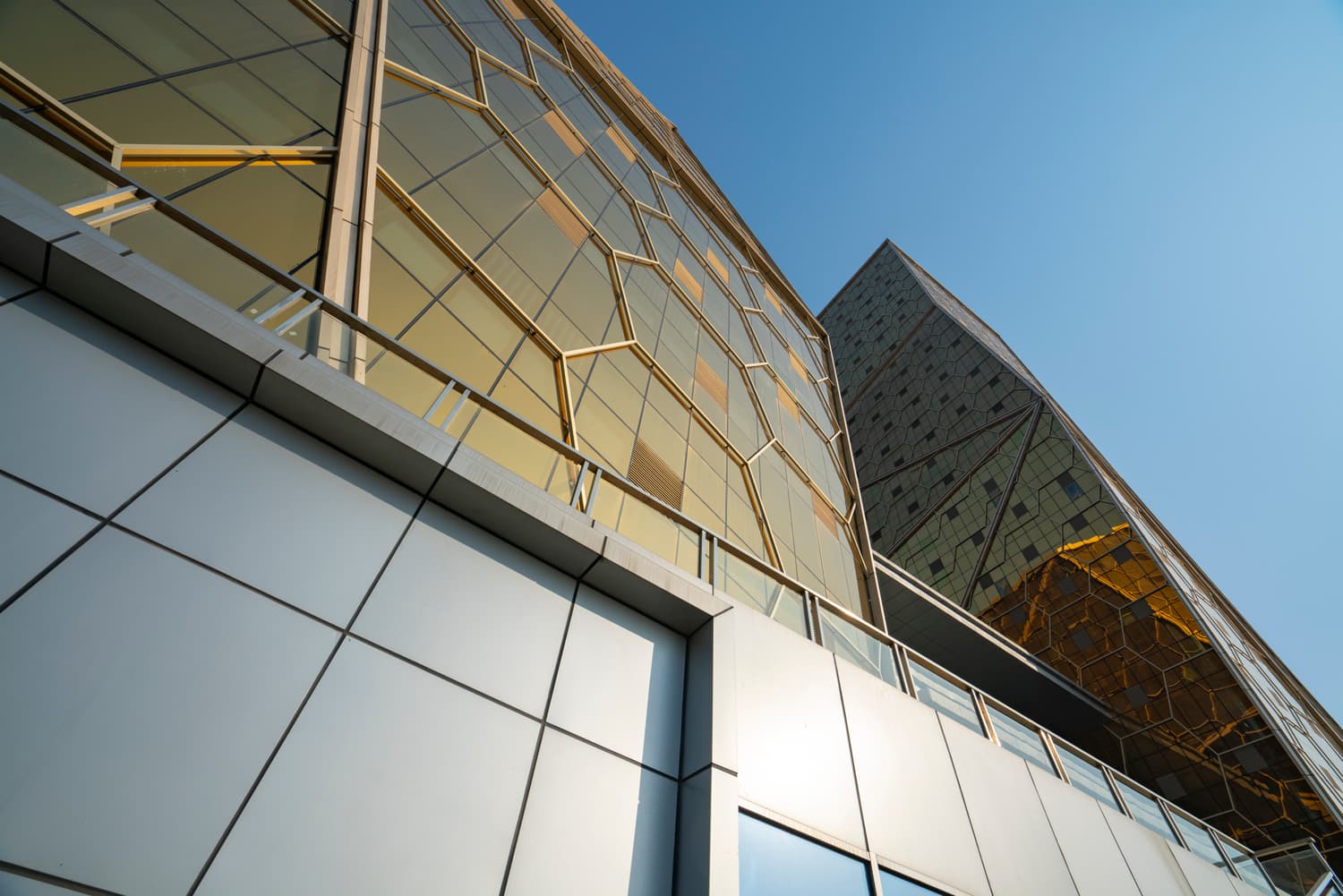 Gold-tinted glass exterior wall of a skyscraper