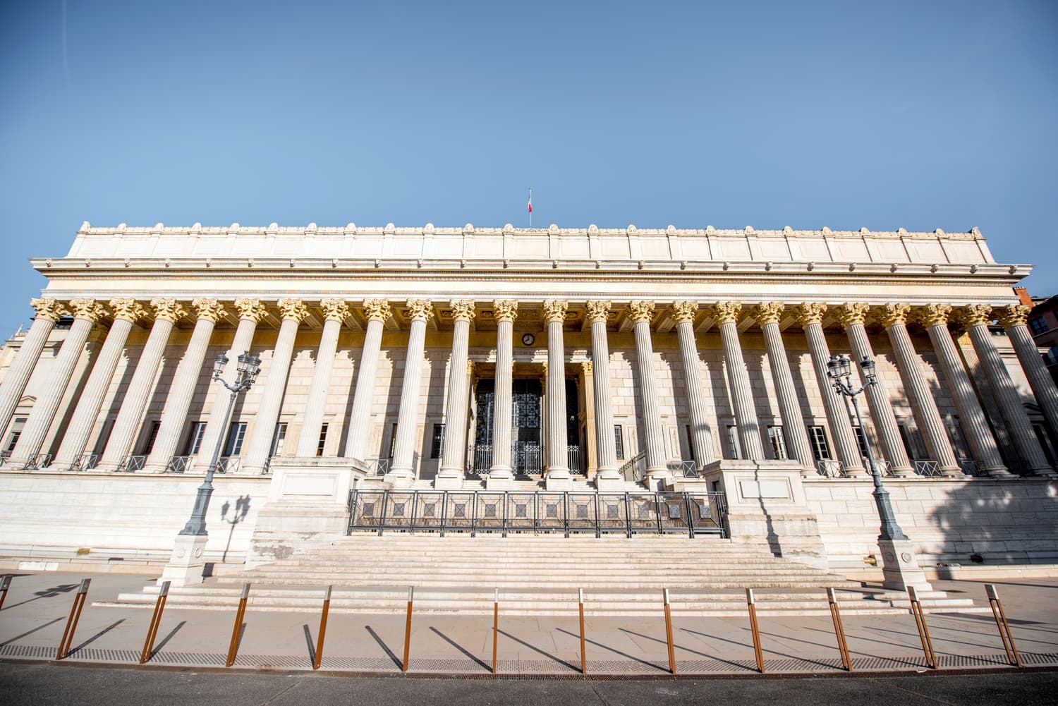 Neoclassical colonnade of a palace facade in Lyon at morning
