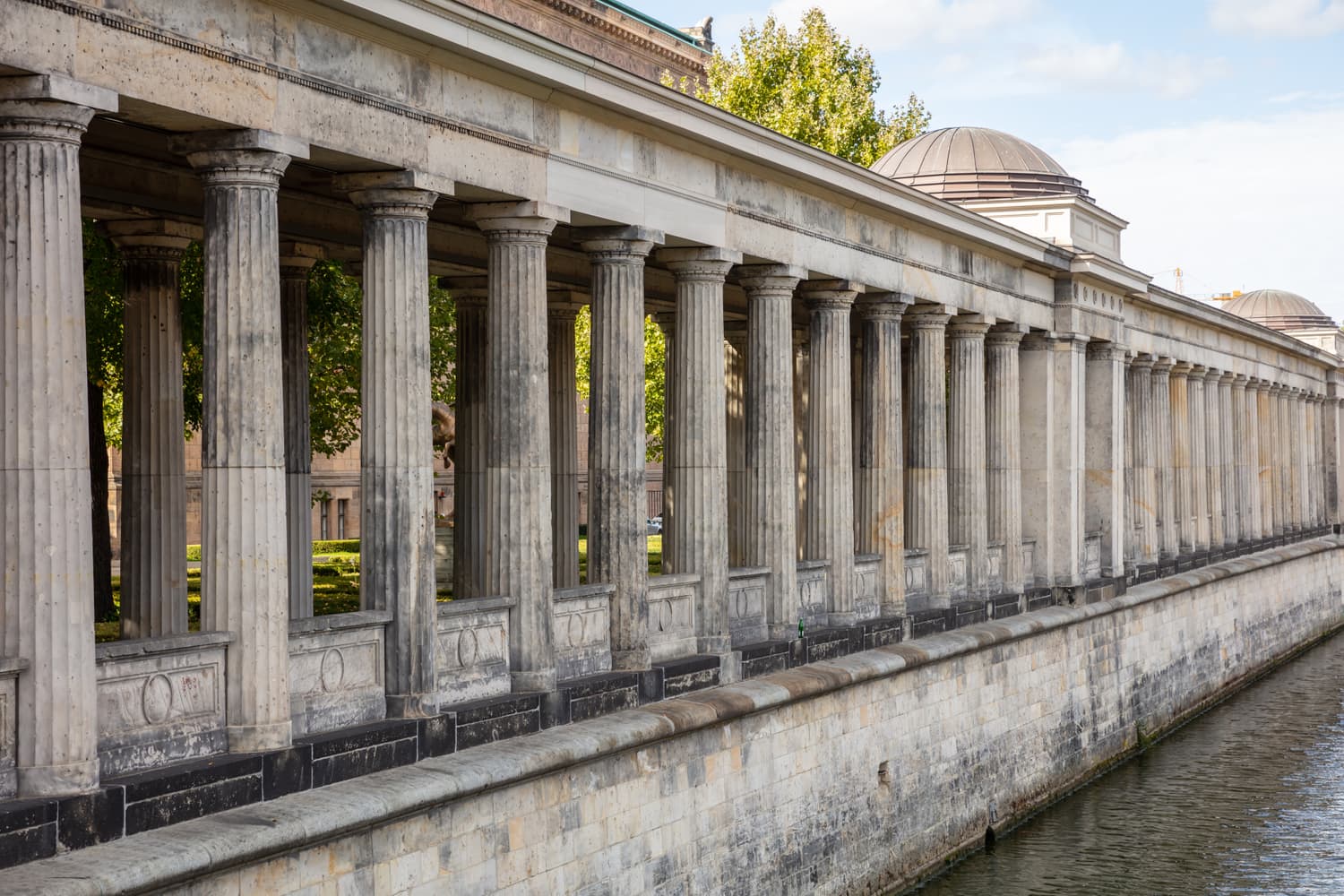 Colonnade of stone pillars seen from below