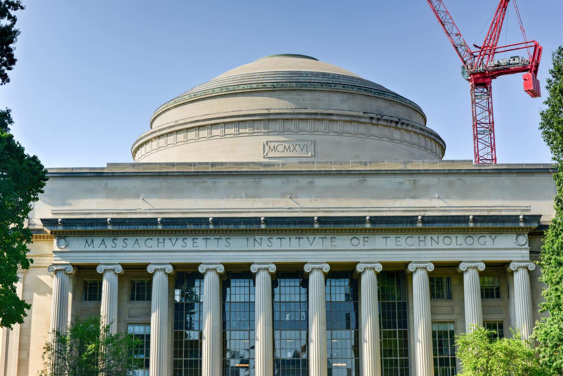 Domed neoclassical institutional building above a stone colonnade