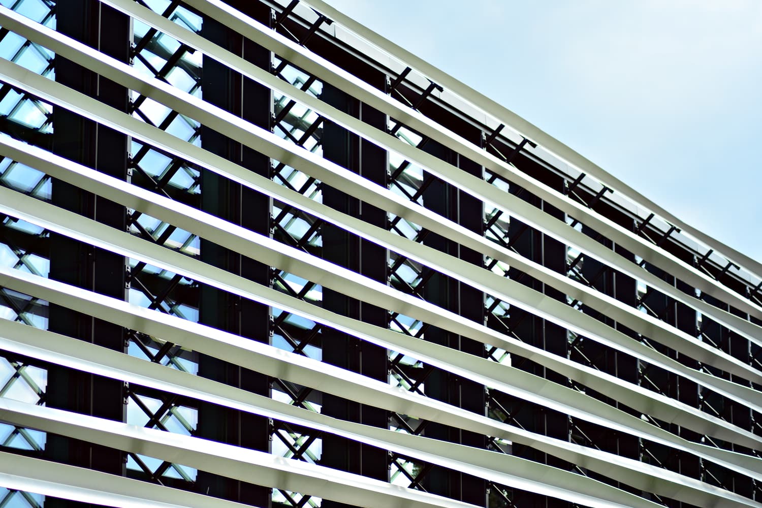 Modern office building with a white metallic panel facade