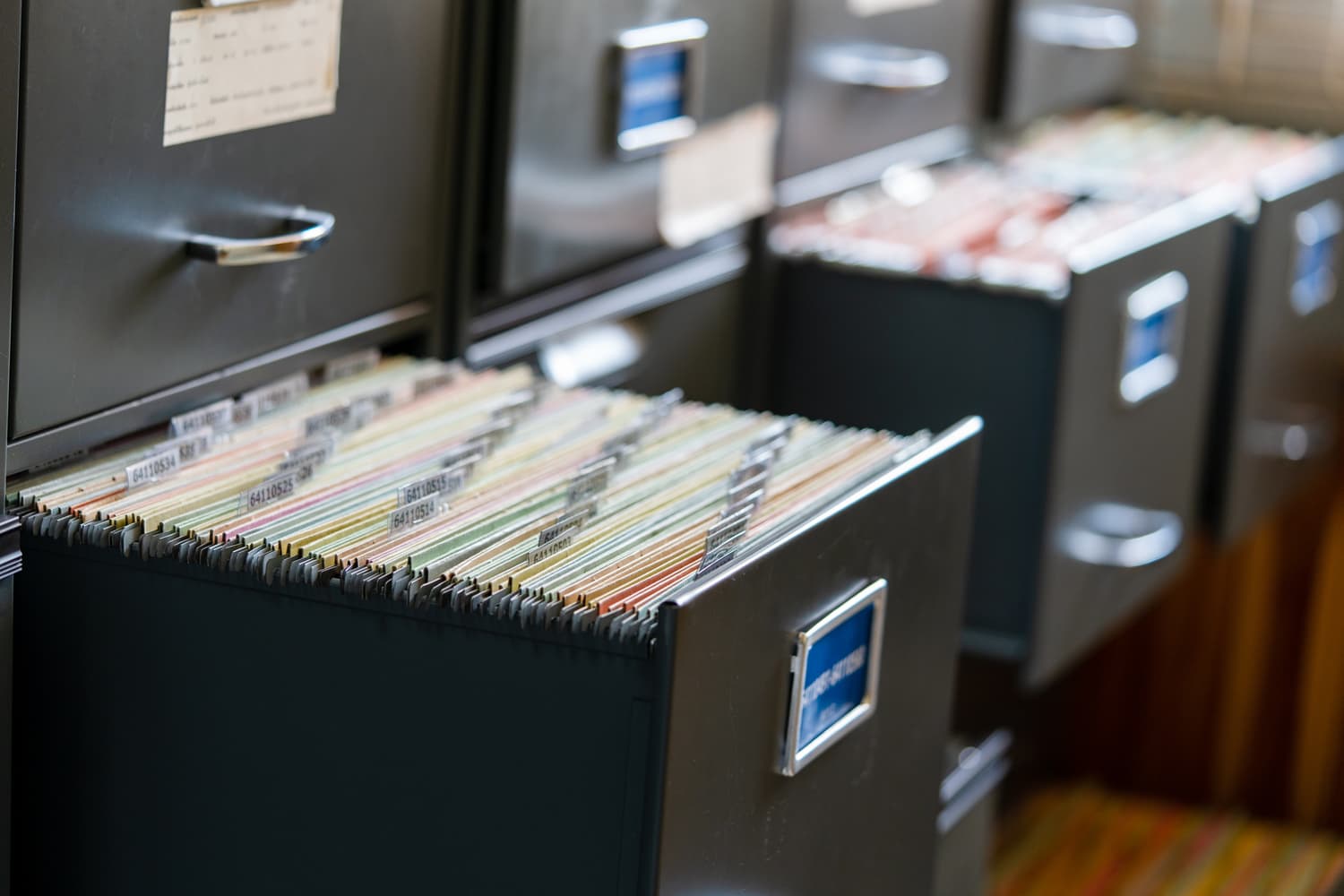 Paper files and documents spread across a work desk
