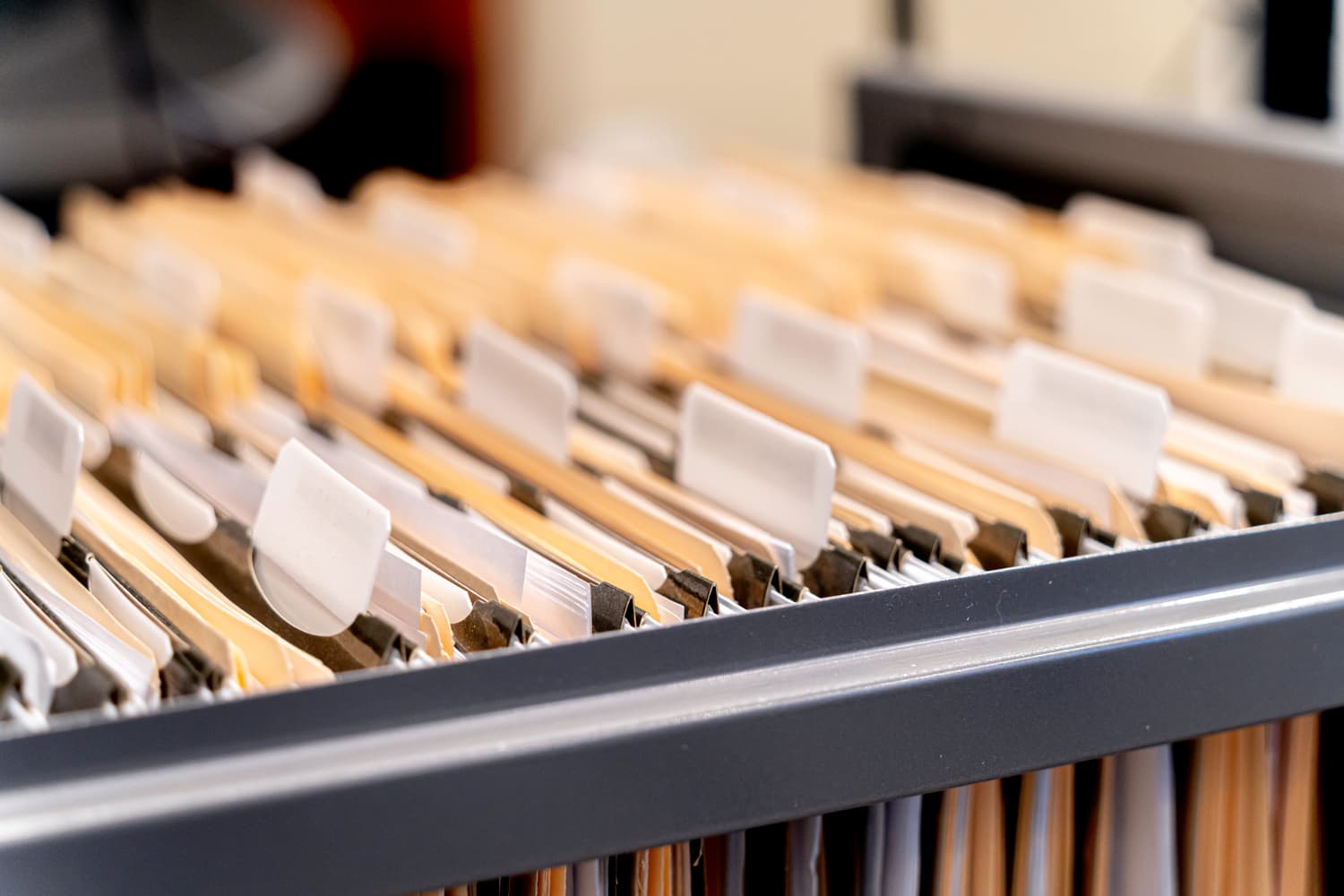 Hanging files inside an open filing cabinet drawer