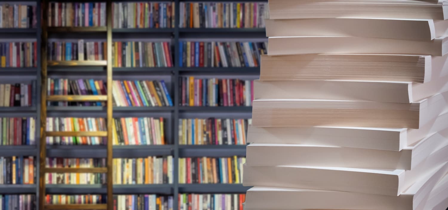 Stacked piles of paper documents