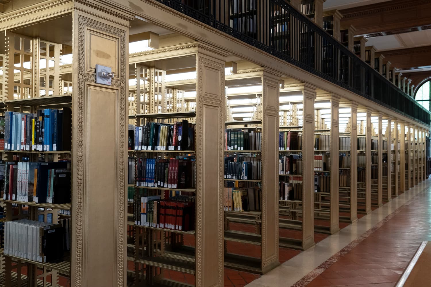 Reading room of a grand public library with long tables